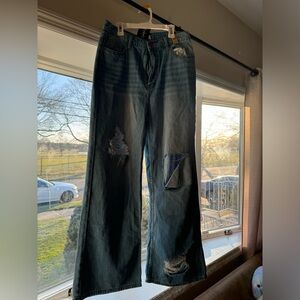 Distressed Blue Jeans with flare on the ankles